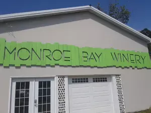 Monroe Bay Winery sign on building