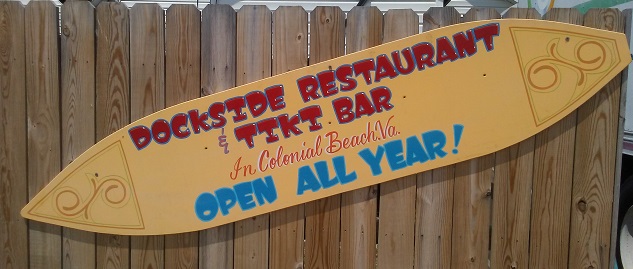 Dockside sign on surfboard