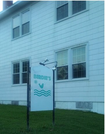 Birdie's sign next to building Birdie's sign next to building