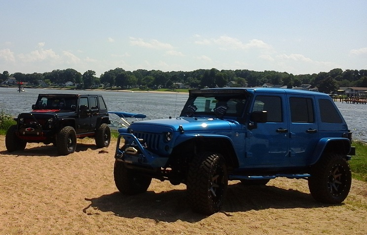 Jeeps on the shoreline