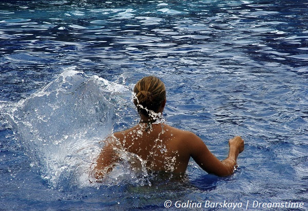 Girl splashing in water